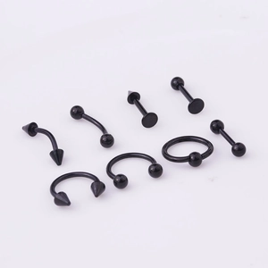 Detail view of 8-piece black stainless steel body piercing set including horseshoe and labret studs
