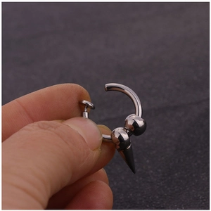 Punk style stainless steel clip-on earring featuring silver beads and a spiked cone pendant