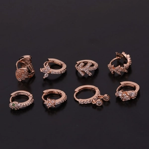 Achtteiliges Set roségoldene Schlangen- und Schmetterlingsohrringe mit Zirkonia-Steinen