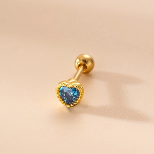 Detail of gold ear stud featuring a blue heart-shaped zircon with beaded edge and ball back