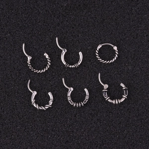 Set of six vintage stainless steel piercing rings with twisted and textured patterns