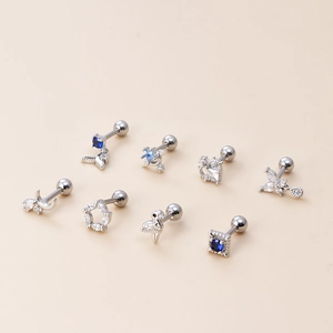 Detailed set of 8 silver stud earrings featuring moons, stars and zircon stones