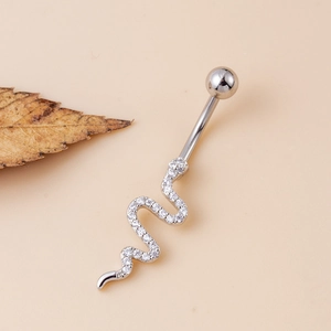 Surgical steel belly button ring featuring a silver snake pendant with white zircons