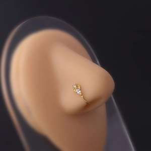 Macro shot of gold-plated non-pierced nose ring with micro-paved cubic zirconia stones