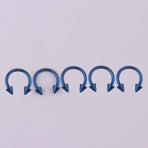 Five-piece blue surgical steel horseshoe septum rings with sharp cone ends for body piercing