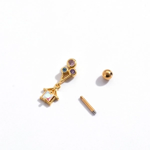 Detail view of gold stainless steel stud featuring colorful gems and a house charm