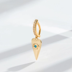 Detail of bohemian gold navel ring with pave crystals and turquoise evil eye pendant