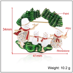 Broche couronne de bonshommes de neige de Noël avec strass brillants et émail vert poli
