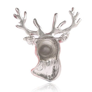 3D buck head brooch in silver alloy with light pink enamel accents, back view showing pin