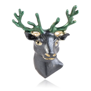 Retro forest style black and green enamel deer head brooch with gold accents on white base