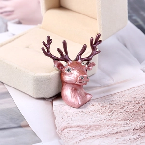 Detailed view of 3D stag brooch featuring pink enamel gradient and purple antlers