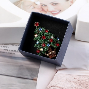 Handcrafted Christmas tree brooch with green beads and rhinestones in a blue gift box