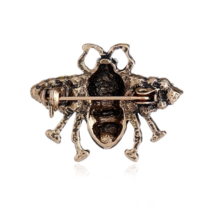 Vintage gold bee brooch with pearl details featuring a secure back pin closure