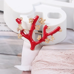 Exquisite red coral branch brooch with golden plum blossoms and a tiny bird detail