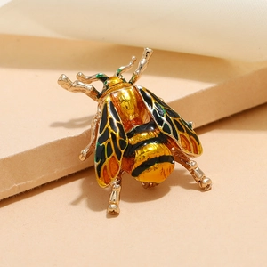 Charming gold-tone cicada animal brooch featuring yellow and black enamel oil wings