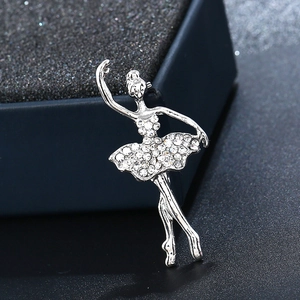 Macro close-up of crystal ballet dancer brooch featuring silver metal and white rhinestones