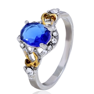 Adjustable woven ring with oval blue gemstone and diamond accents on dual-tone band