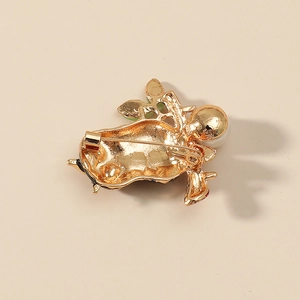 Golden owl brooch with white faux pearl and secure safety pin fastener back view