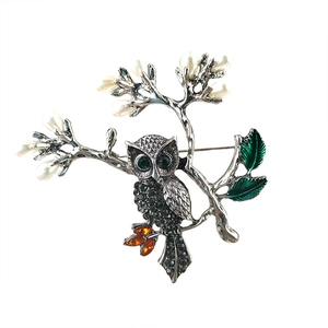 Vintage owl brooch with rhinestones and white pearls on branch, silver metal finish