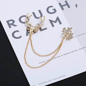 Vintage gold reindeer and tree brooch set with sparkling rhinestones and double chains