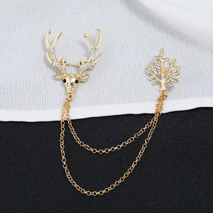 Vintage gold reindeer and tree brooch with rhinestones and double chains for holiday gift