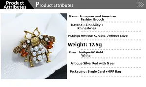 Detail of bee brooch with pearls and rhinestones on silk fabric showing 17.5g weight