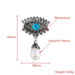 Retro Evil Eye brooch detail with rhinestones and white pearl droplet dimensions
