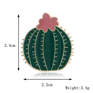 Detail view of green cactus enamel brooch showing dimensions 2.4cm by 2.2cm and weight 3.4g