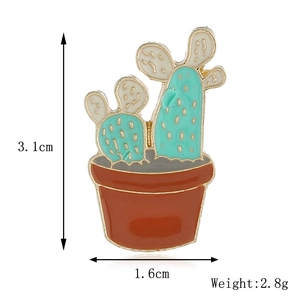 Detail showing enamel cactus pin dimensions of 3.1cm height and 1.6cm width