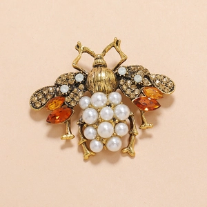 Antique gold bee brooch with amber rhinestones and white pearl inlay on wings