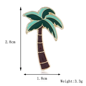 Detail of coconut tree enamel brooch with dimensions 2.8cm by 1.8cm on white background