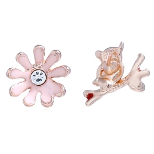 Detail of asymmetric owl and pink enamel flower studs with rose gold plating