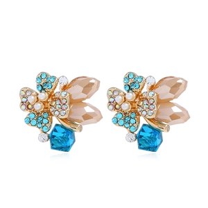 Detail of butterfly earrings with teal crystal drops and mixed colorful rhinestones