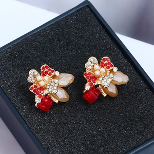Elegant French vintage floral earrings with red rhinestones and pearls on black box