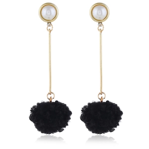 Long earrings with white faux pearl studs, sleek gold bars, and fluffy black pompom pendants