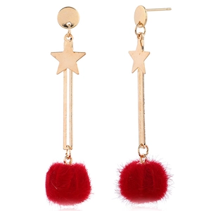 Red fur ball dangle earrings with gold star and moon accents for a sweet elegant look