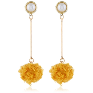 Long dangle earrings featuring white pearls and bright yellow fuzzy pom-poms on gold rods