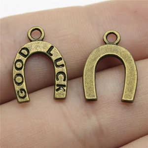 Pair of antique bronze horseshoe charms with Good Luck engraving for DIY jewelry