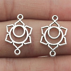 Silver chakra geometric connector charms on finger showing actual size for DIY jewelry