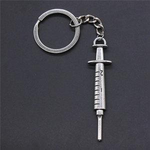 Vintage silver syringe keychain with realistic scale marks and durable metal ring