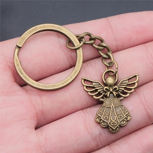 Vintage bronze angel pendant keychain with detailed wing carvings and metal link chain