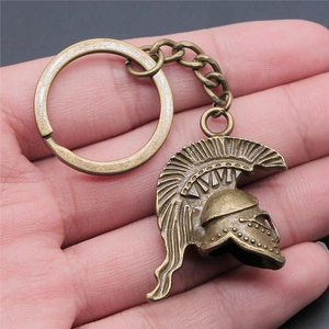Vintage Roman warrior helmet keychain in antique bronze finish with 3D Spartan design