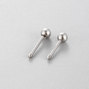 Pair of minimalist silver stainless steel ball stud piercings with threaded screw ends