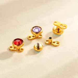 Set microdermal in titanio G23 dorato con pietre di zircone rotonde rosse e viola
