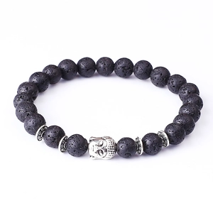 Lava stone bead bracelet with silver Buddha head charm on a clean white background