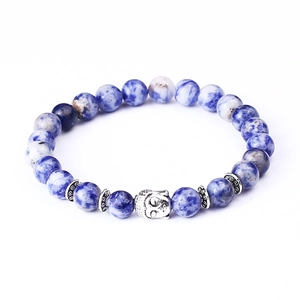 Detailed view of blue marbled stone beads bracelet with silver Buddha head charm