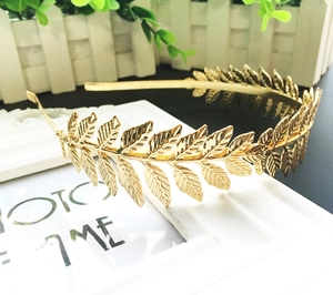 Macro detail of golden laurel leaf headband with metallic leaves for Greek goddess style