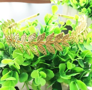 Golden laurel leaf headband with metallic leaves for women in classic Greek style