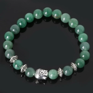 Detail view of green natural stone beads and silver Buddha head charm on the bracelet