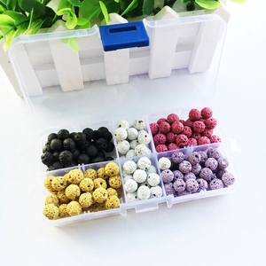 Detailed view of multicolor volcanic lava stone beads for DIY jewelry in storage box